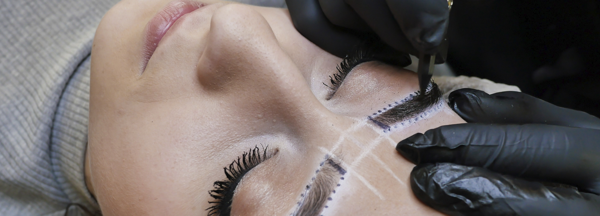 Woman getting elite eyebrows done